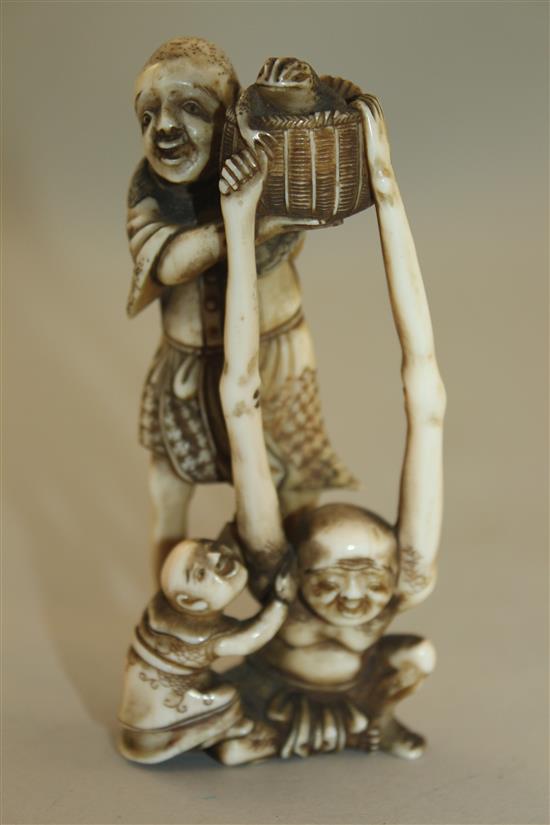 A Japanese ivory okimono of Ashinaga and Tenaga, Meiji period, 10.3cm